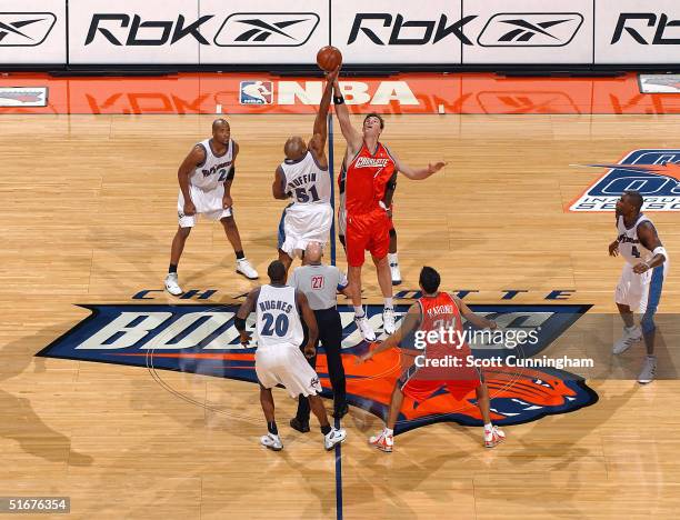 Primoz Brezec of the Charlotte Bobcats jumps for the season opening tip against Michael Ruffin of the Washington Wizards in a game on November 4,...