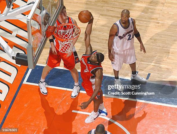 Melvin Ely of the Charlotte Bobcats dunks against the Washington Wizards in a game on November 4, 2004 at the Charlotte Coliseum in Charlotte, North...