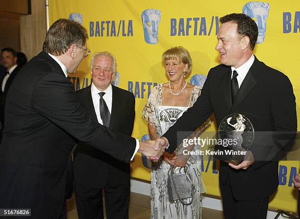 Director Robert Zemeckis greets actor Tom Hanks , director James Sheridan and actress Helen Mirren at the 13th Annual BAFTA/LA Britannia Awards at...