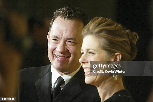 Actors Tom Hanks and his wife Rita Wilson arrive at the 13th Annual BAFTA/LA Britannia Awards at the Beverly Hilton Hotel on November 4, 2004 in...