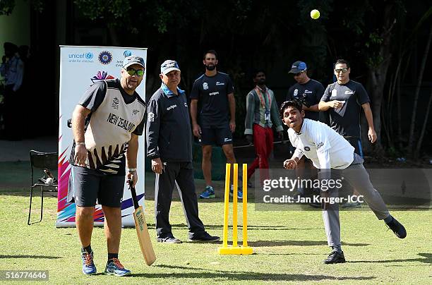 Batting coach Craig McMillan plays cricket with local youth during the ICC Cricket For Good and Team Swachh cricket clinic in partnership with UNICEF...