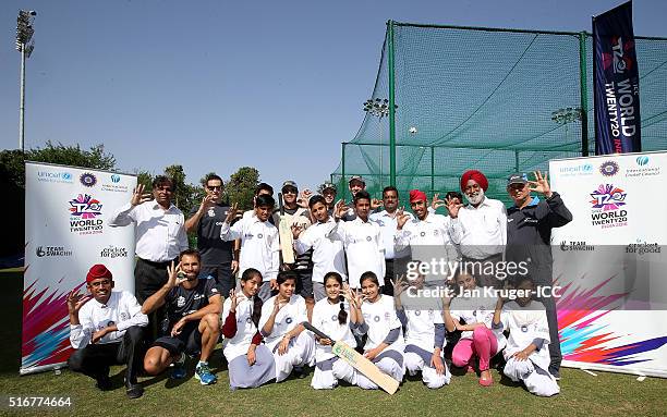 Luke Ronchi, Grant Elliott, Nathan McCullum, Henry Nicholls and batting coach Craig McMillan pose with local youth during the ICC Cricket For Good...