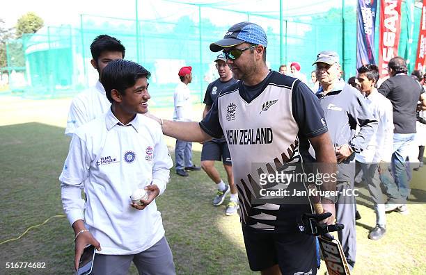 Batting coach Craig McMillan plays cricket with local youth during the ICC Cricket For Good and Team Swachh cricket clinic in partnership with UNICEF...