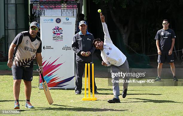 Batting coach Craig McMillan plays cricket with local youth during the ICC Cricket For Good and Team Swachh cricket clinic in partnership with UNICEF...