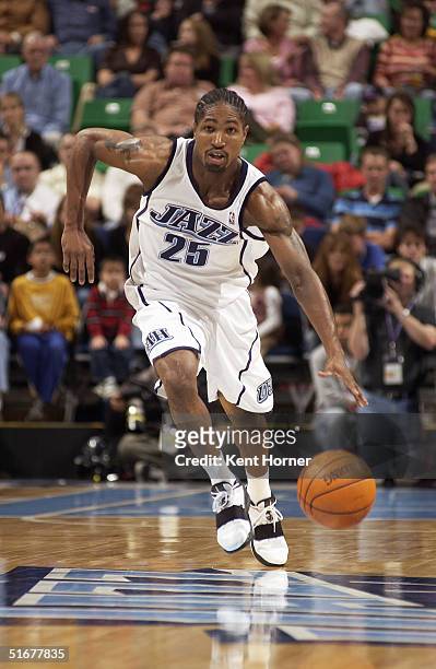 Keith McLeod of the Utah Jazz brings the ball upcourt during the preseason game against the Sacramento Kings at Delta Center on October 22, 2004 in...