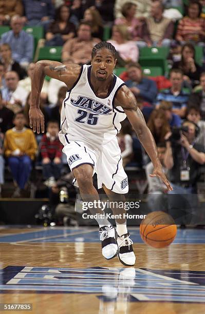 Keith McLeod of the Utah Jazz brings the ball upcourt during the preseason game against the Sacramento Kings at Delta Center on October 22, 2004 in...