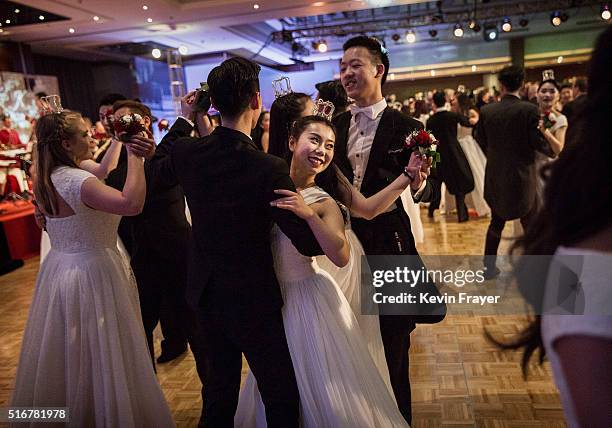 Chinese and foreign debutantes dance during the Vienna Ball at the Kempinski Hotel on March 19, 2016 in Beijing, China. The ball, which is an event...