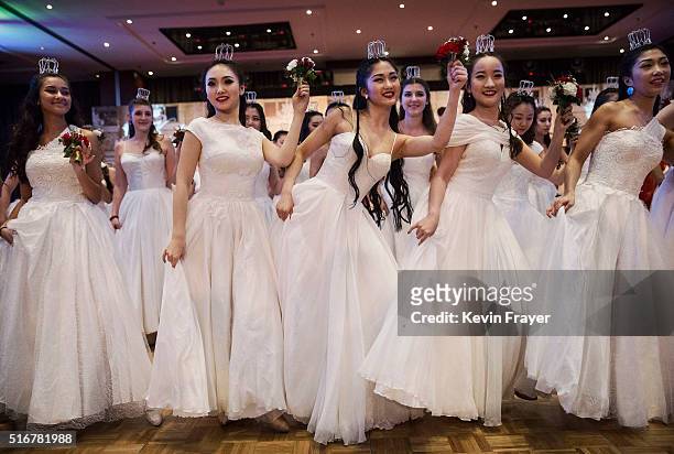 Chinese and foreign debutantes dance during the Vienna Ball at the Kempinski Hotel on March 19, 2016 in Beijing, China. The ball, which is an event...