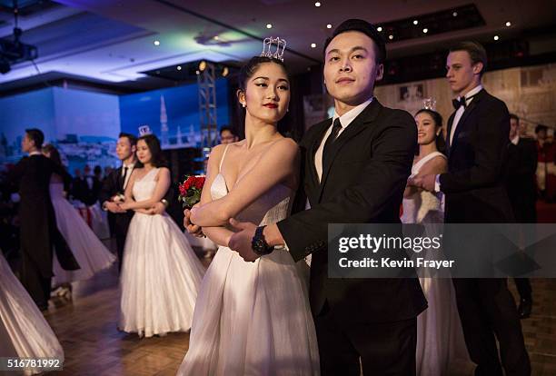 Chinese and foreign debutantes dance during the Vienna Ball at the Kempinski Hotel on March 19, 2016 in Beijing, China. The ball, which is an event...