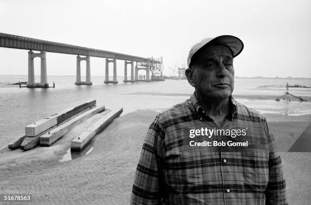 American public official and city planner Robert Moses at a construction site for a Long Island highway bridge, probably the Captree State Parkway...