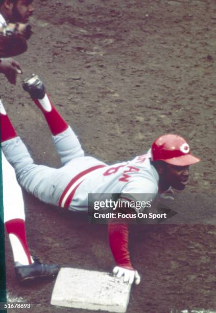 Cincinnati Reds' Joe Morgan dives back to first during the 1975 World Series against the Boston Red Sox at Fenway Park in Boston, Massachusetts.