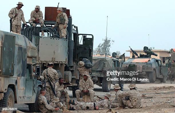 Marines from the 1st Expeditionary Force, 1st Battalion prepare for a possible offensive November 5 near Fallujah, Iraq. U.S. Fighter jets conducted...