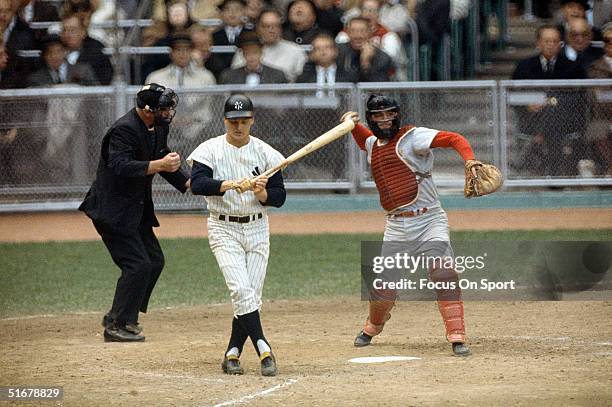 Roger Maris of the New York Yankees strikes out during the1964 world series against the St. Louis Cardinals at Yankee Stadium in Bronx, New York.