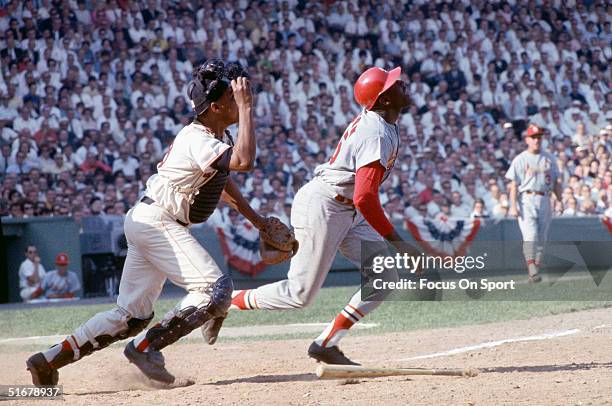 Bob Gibson of the Red Sox runs after batting against the St. Louis Cardinals in the 1967 World Series at Fenway Park in Boston, Massachusetts.