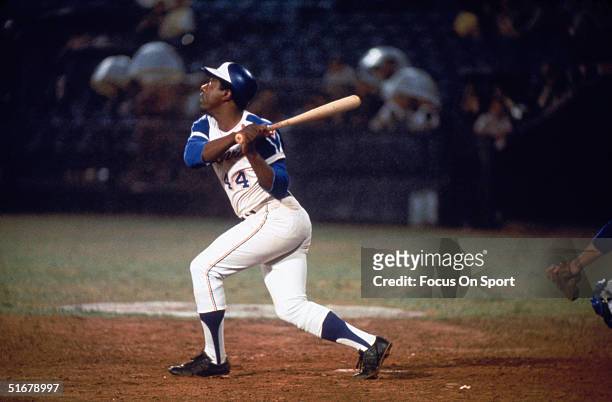 Hall of famer Hank Aaron of the Atlanta Braves swings at the ball.
