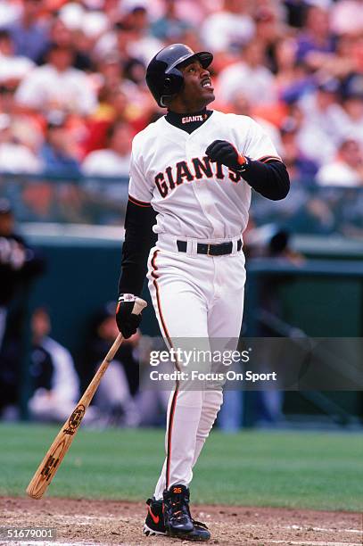 Barry Bonds of the San Francisco Giants watches the ball fly after connecting at 3Com Park in San Francisco, California.