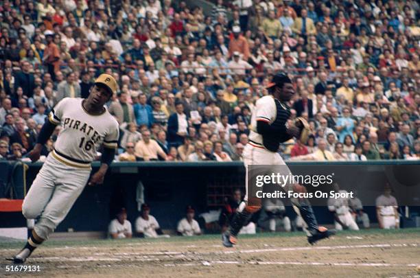 Pirates' Al Oliver scores against the Orioles during the 1971 World Series at Memorial Stadium in Baltimore, Maryland.