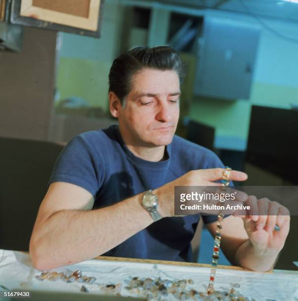 American Albert DeSalvo shows off his jewelry-making skills at Walpole State Prison, South Walpole, Massachusetts, early 1970s. DeSalvo is the...