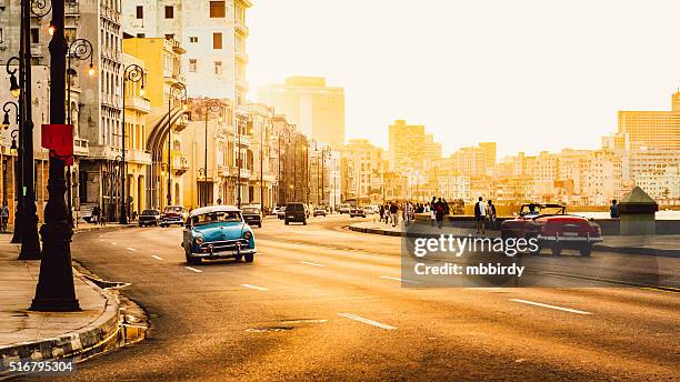 traffic at malecon, havana, cuba - cuba travel stock pictures, royalty-free photos & images