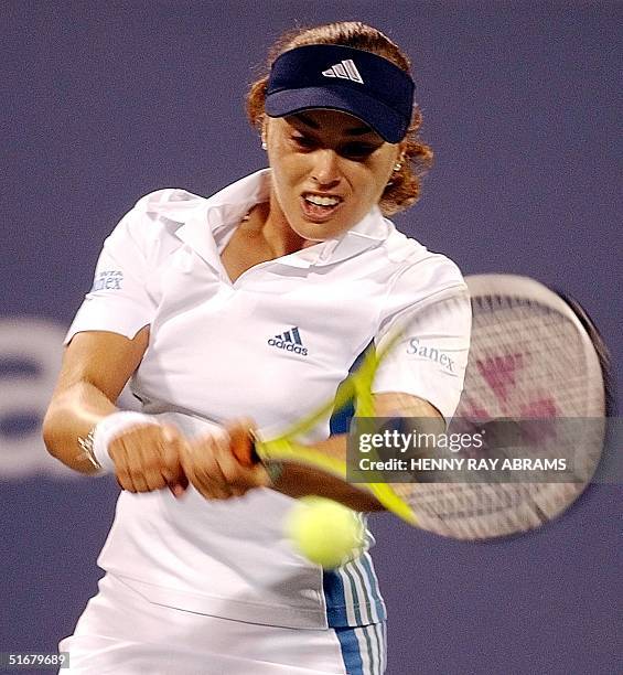 Number 9 Martina Hingis of Switzerland hits a backhand return to Antonella Serra Zanetti of Italy during their second round match 29 August, 2002 at...