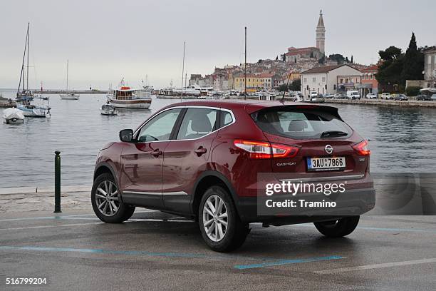 nissan qashqai stopped on the street - nissan qashqai stock pictures, royalty-free photos & images