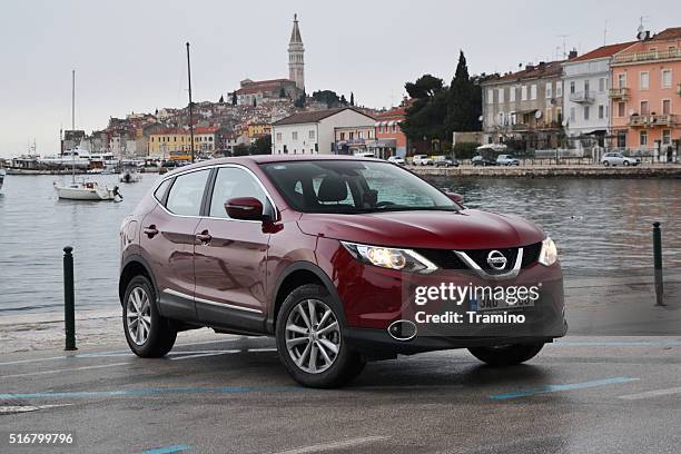 nissan qashqai stopped on the street - nissan qashqai stock pictures, royalty-free photos & images