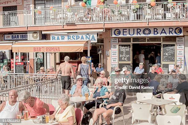 British expats and tourists enjoy the atmosphere at outdoor bars in Bonanza's square on March 17, 2016 in Benalmadena, Spain. Spain is Europe's top...