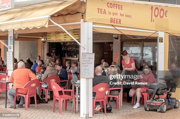 Expats and tourists have breakfast at a bar on March 19, 2016 in Fuengirola, Spain. Spain is Europe's top destination for British expats with the...