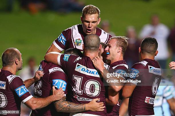 Brett Stewart, Feleti Mateo, Tom Trbojevic, Nate Myles, Daly Cherry-Evans and Dylan Walker of the Eagles celebrate Jake Trbojevic scoring a try...