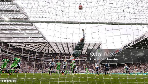 Rob Elliott of Newcastle United tips a Jack Rodwell header over the bar during the Barclays Premier League match between Newcastle United and...