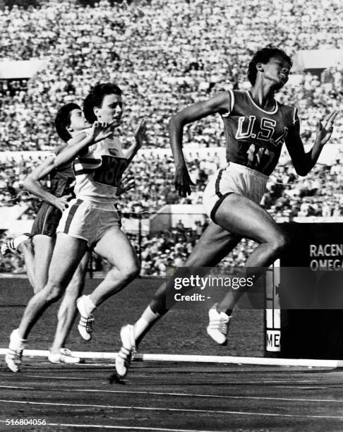 Nicknamed "the black gazelle", U.S champion Wilma Rudolph crosses the finish line of the Olympic 100m event, that she wins, establishing a new world...