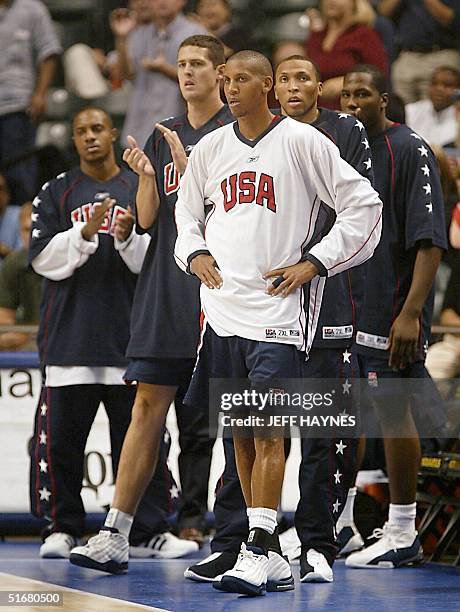 Reggie Miller and other USA team memebers watch as their team plays Yugoslavia in the 2002 Men's FIBA World Basketball Championships quarter-finals...