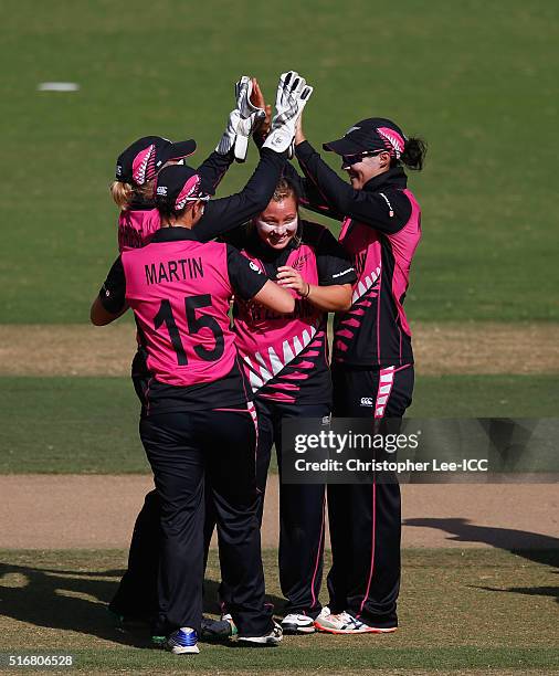 Leigh Kasperek of New Zealand is congratulated after she takes the wicket of Erin Osbourne of Australia during the Women's ICC World Twenty20 India...