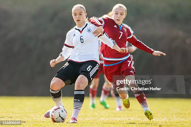 Lisa Schoeppl of Germany competes for the ball with Viktoriia Dubova of Russia during the U17 Girl's Euro Qualifier match between Germany and Russia...