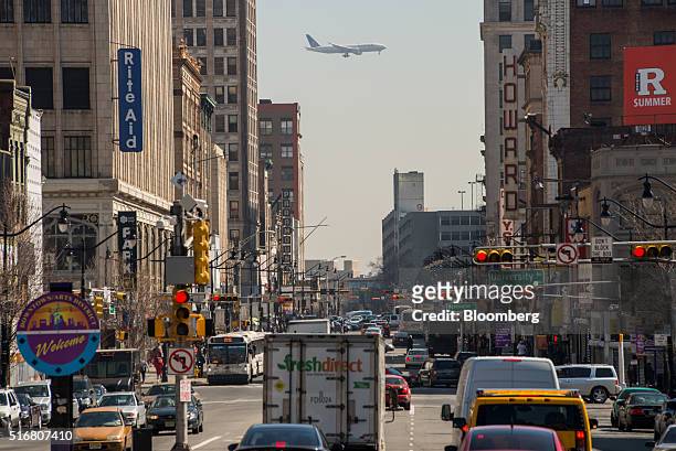 Plane is seen flying over Market Street heading towards Newark International Airport in Newark, New Jersey, U.S., on Wednesday, March 9, 2016. New...
