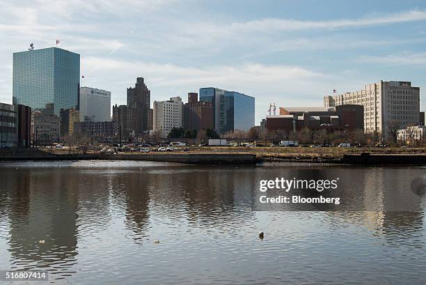 The New Jersey Performing Arts Center, second right, and the Prudential Financial Inc. Building, second left, are seen in the skyline of Newark, New...