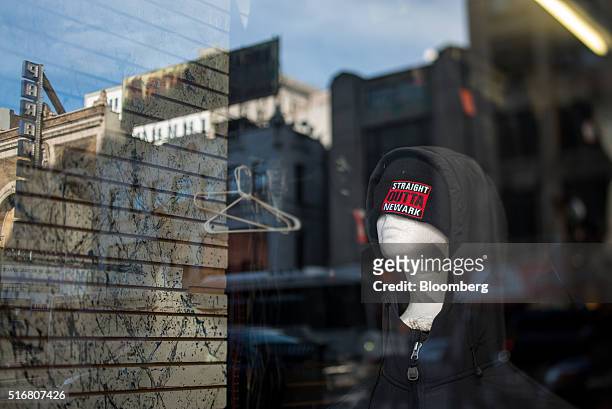 Straight Outta Newark" hat is displayed for sale in the window of a shop on Market Street in Newark, New Jersey, U.S., on Wednesday, March 9, 2016....