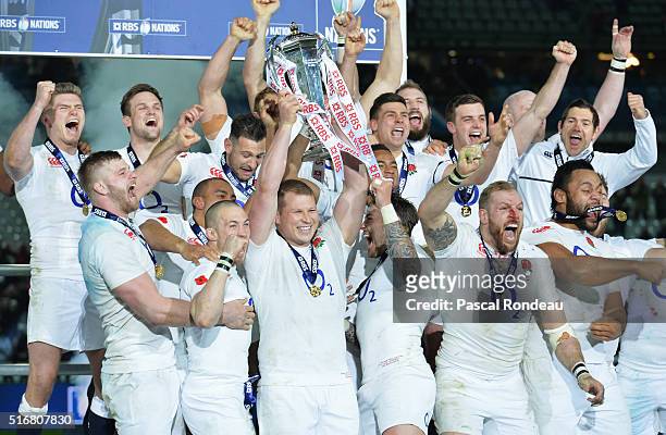 Dylan Hartley of England lifts the RBS Six Nations trophy after England won the Grand Slam during the RBS Six Nations match between France and...
