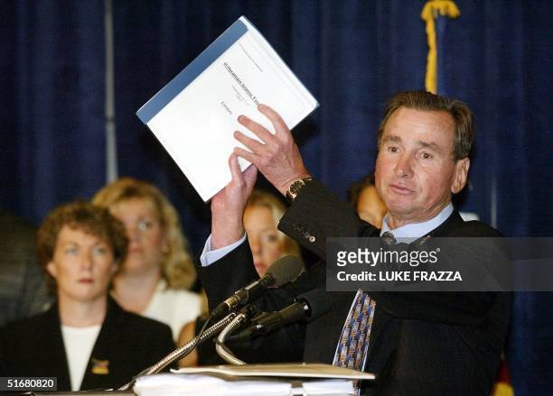 Lawyer Ron Motley holds a copy of a lawsuit he is filing against financial backers of terrorists on behalf of 11 September victims and their...