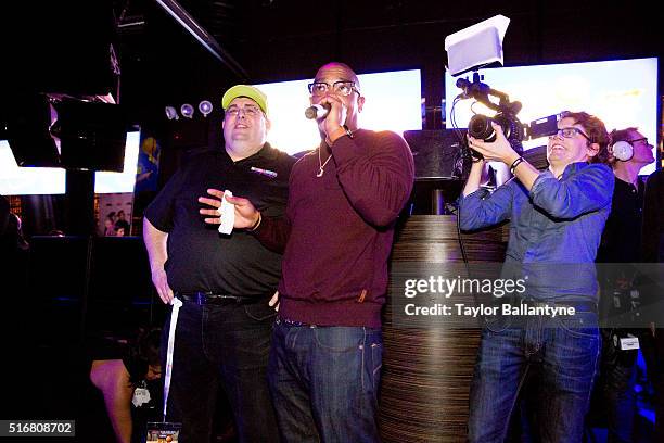 Bracket Challenge Party: Celebrity rapper Ja Rule performing on stage during event at Slate. View of Kizzang founder and president Robert Alexander...