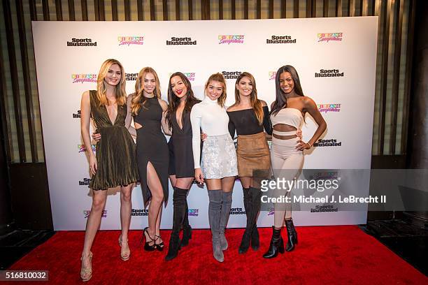 Bracket Challenge Party: SI Swimsuit models Megan Williams, Caroline Kelley, Mia Kang, Daniela Lopez, Kyra Santoro, and Ebonee Davis posing on red...
