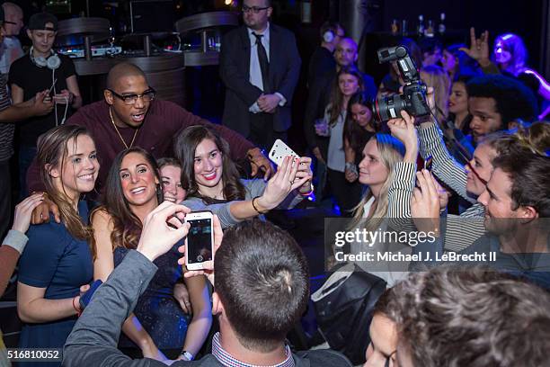 Bracket Challenge Party: Celebrity rapper Ja Rule poses for selfie photograph with SI employees before performance during event at Slate. New York,...