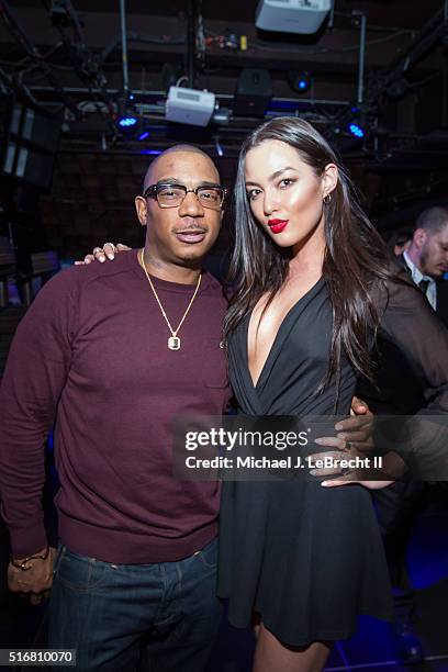 Bracket Challenge Party: Celebrity rapper Ja Rule posing for photograph with SI Swimsuit model Mia Kang during event at Slate. New York, NY 3/14/2016...