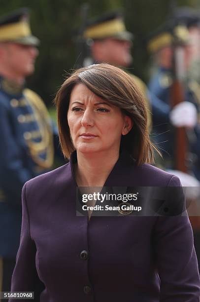 Kosovo President Atifete Jahjaga walks past a Kosovar guard of honour as she arrives at the Assembly of Kosovo, the Kosovoso parliament building, on...
