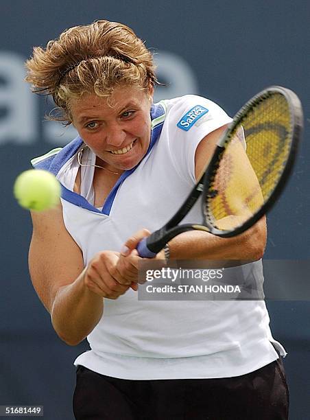 Marie-Gaianeh Mikaelian of Switzerland returns volley to Anna Smashnova of Israel during the first round of the US Open Tennis Tournament 27 August,...