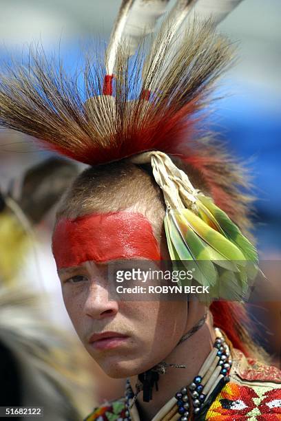 Cody Jacobs of the Lumbee Native American Indian tribe concentrates before performing in a competitive traditional dance at a powwow in Urbana,...