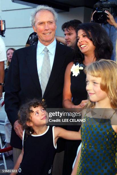 Writer/director and lead actor Clint Eastwood poses with his wife and co-star Dina Eastwood, their daughter Morgan and his daughter Franny as they...