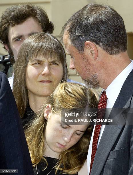 The family of John Walker Lindh console each other outside the Albert V. Bryan Federal Courthouse in Alexandria, VA, 15 July, 2002. Lindh pleaded...