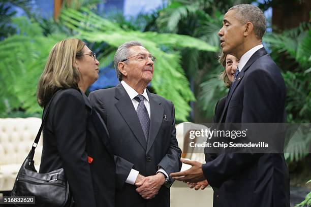 Cuban President Raul Castro and U.S. President Barack Obama speak to each other with the help of translators at the Palace of the Revolution March...