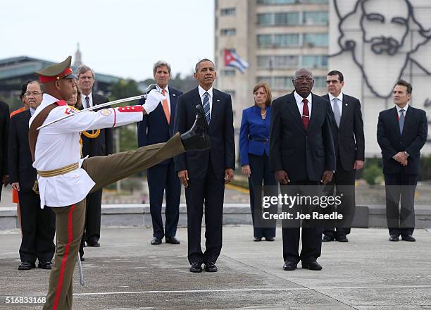 President Barack Obama stands with Salvador Valdez Mesa, Vice President of the Council of Ministry, as they take part in a wreath laying ceremony at...